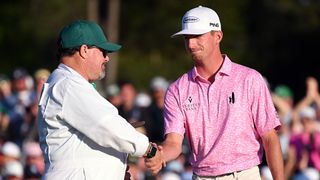 Sam Bennett shakes hands with Brian Kortan after the 2023 Masters
