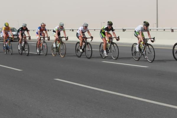 Riders string out on the bridge over the highway where the course is about to go