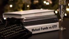 Stack of notebooks and a binder that says "Mutual Funds vs. ETF"
