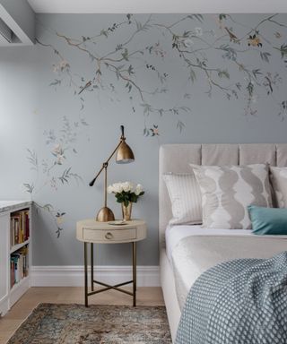 bedroom with blue patterned wallpaper