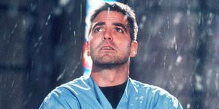 Doug Ross (George Clooney) stares into the sky as it rains in ER