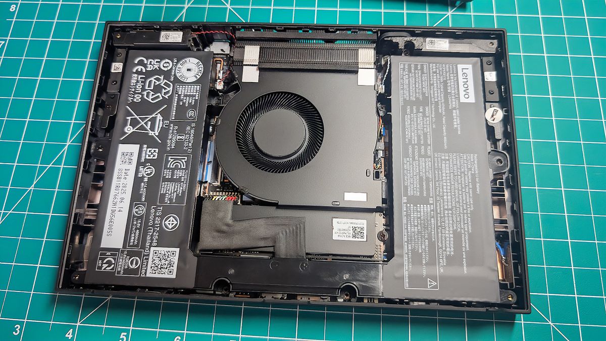 The Lenovo Legion Go 2 opened with the fan, battery, and SSD visible.