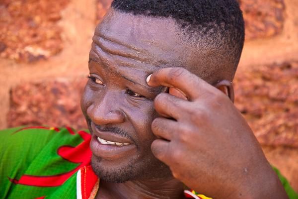 Benin&rsquo;s Augustin Amoussouvi shows the fatigue from a hot day on the bike.