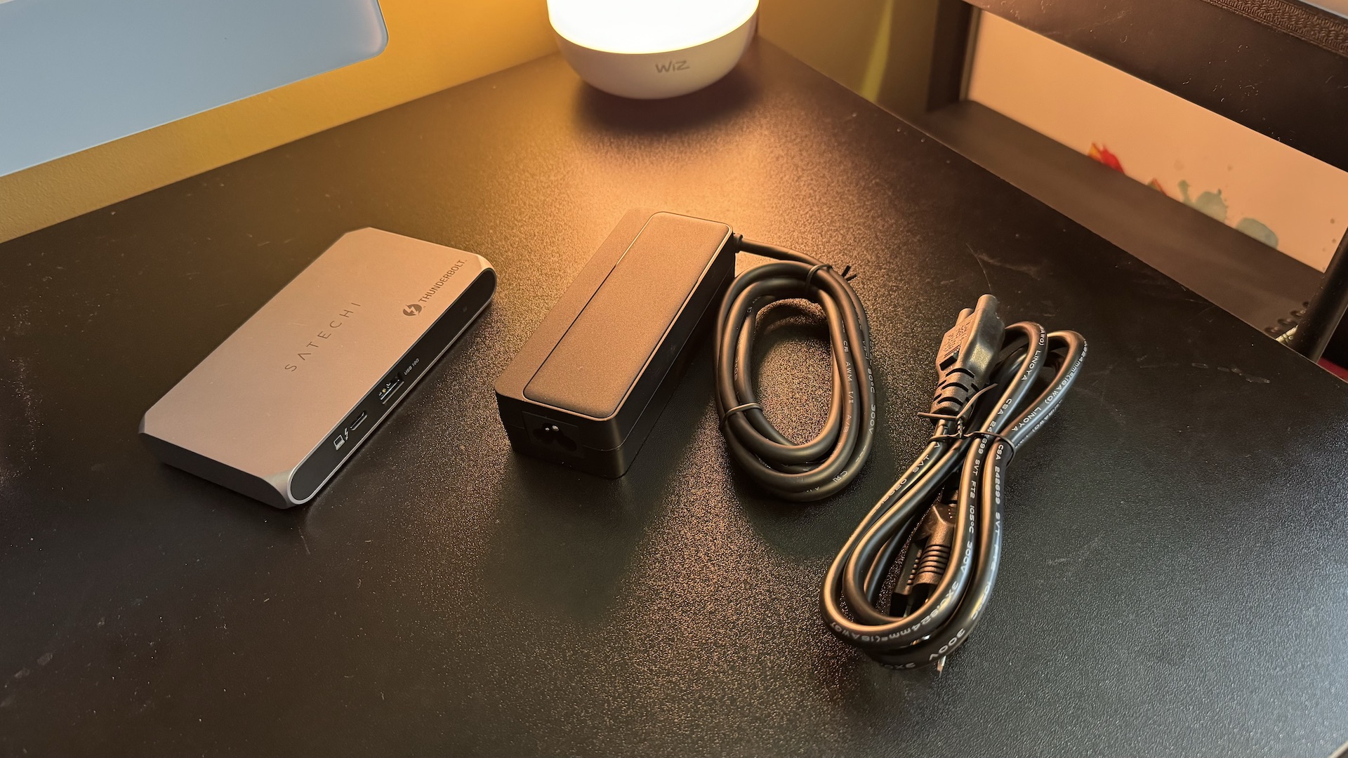 Satechi Thunderbolt 4 Slim Pro Hub on a black desk with Mac and accessories