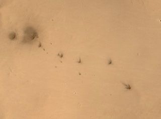 Many craters on Mars come in clusters, because meteoroids often explode into fragments not long before they hit the surface.