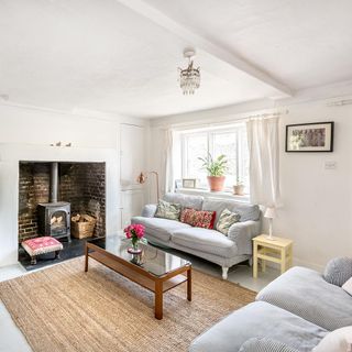 living room with sofa and white wall