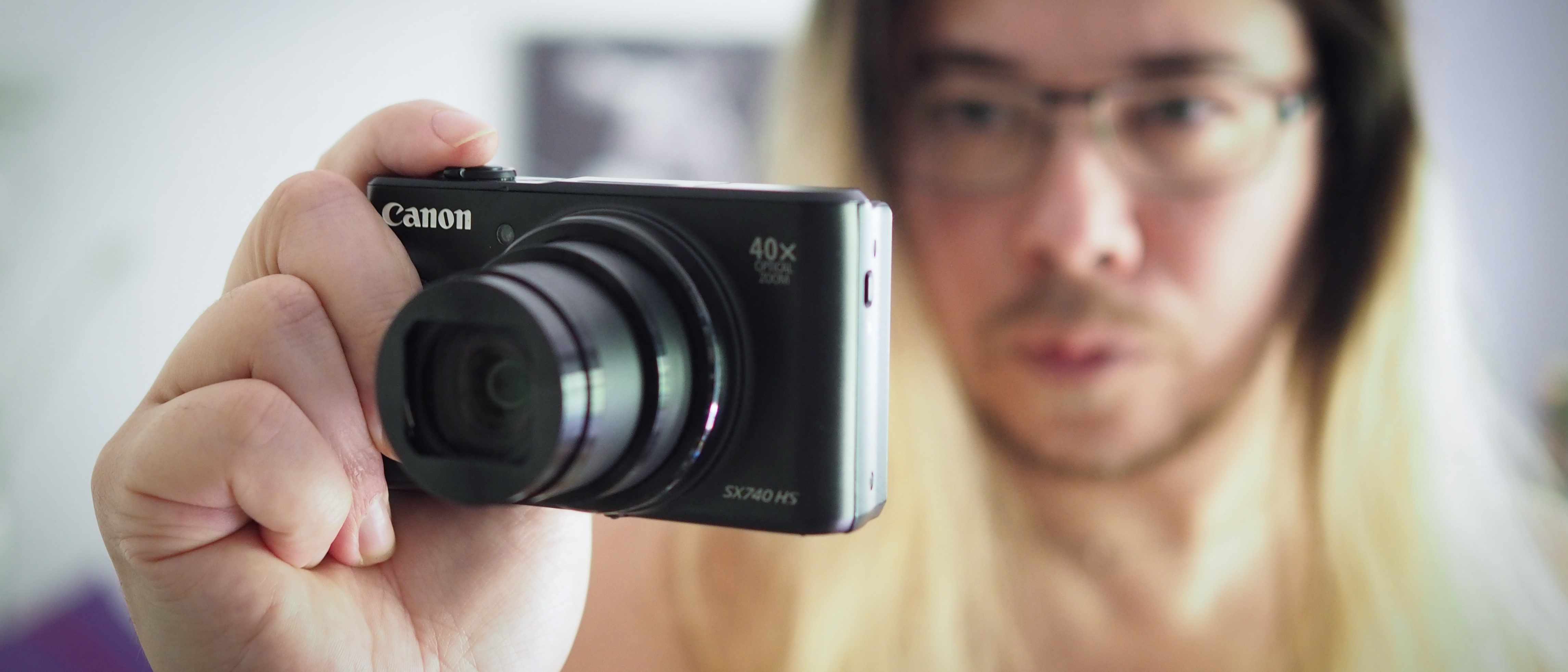 Photographer James Artaius holding the Canon PowerShot SX740 HS