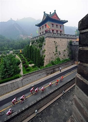 A group of Olympians roll over the Great Wall of China
