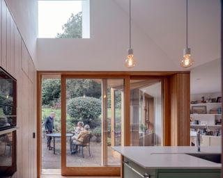 The new kitchen overlooks the woods