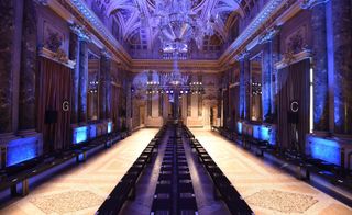 Fashion runway located in a grand marble ballroom