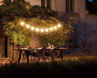 Garden at night with string lighting