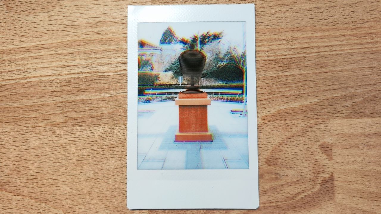 Instant photos on a wooden table