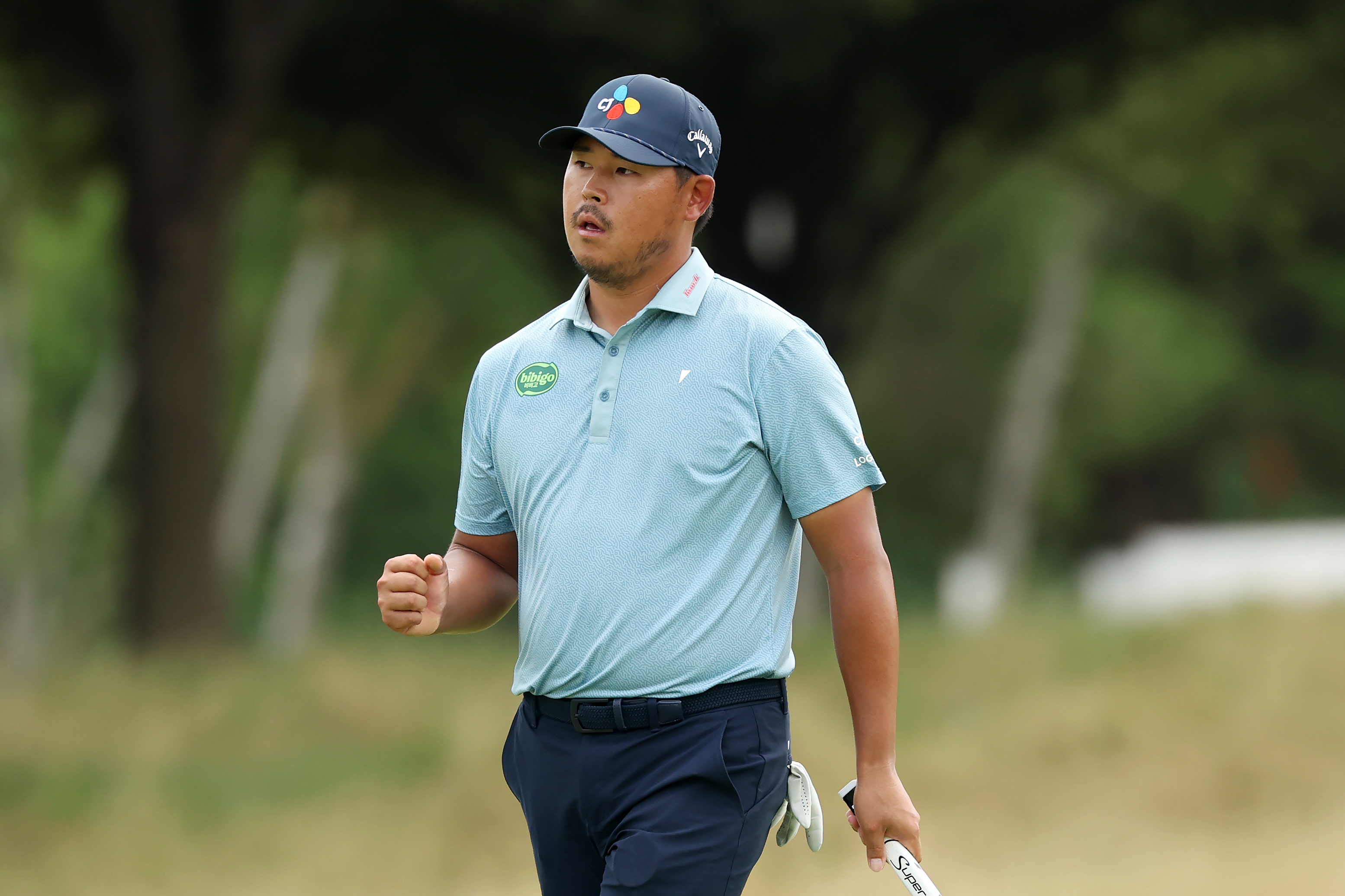 Si Woo Kim of the Republic of Korea reacts after making birdie on the seventh green during the final round of THE CJ CUP Byron Nelson