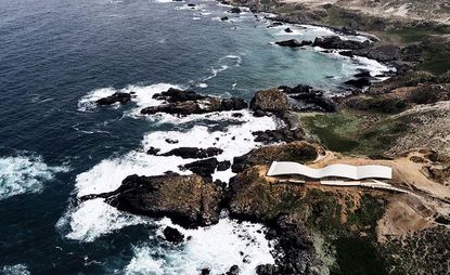 Birdseye view of cliffs next to the sea