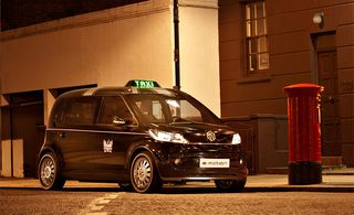 View of new Taxi on street.