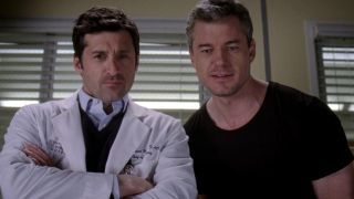 Patrick Dempsey and Eric Dane, standing side by side as their Grey's Anatomy characters Derek Shepherd and Mark Sloan.