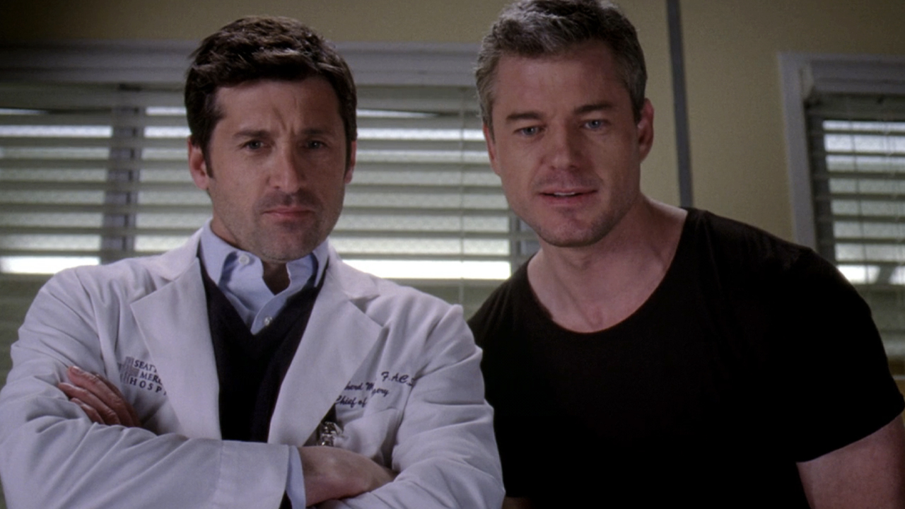 Patrick Dempsey and Eric Dane, standing side by side as their Grey's Anatomy characters Derek Shepherd and Mark Sloan.