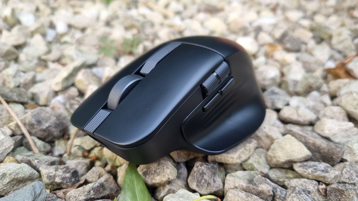 An Asus ProArt Mouse MD301 on white gravel