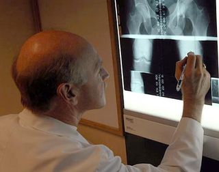 Dr. Pruitt examines Christoph Sauser's X-Rays