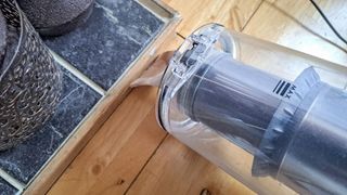 Vacuum cleaning hack in floor crevice