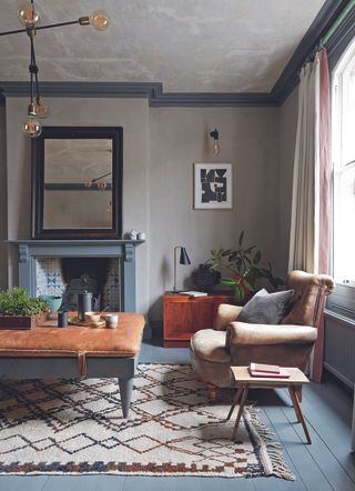 Dark grey living room with painted wooden floorboards