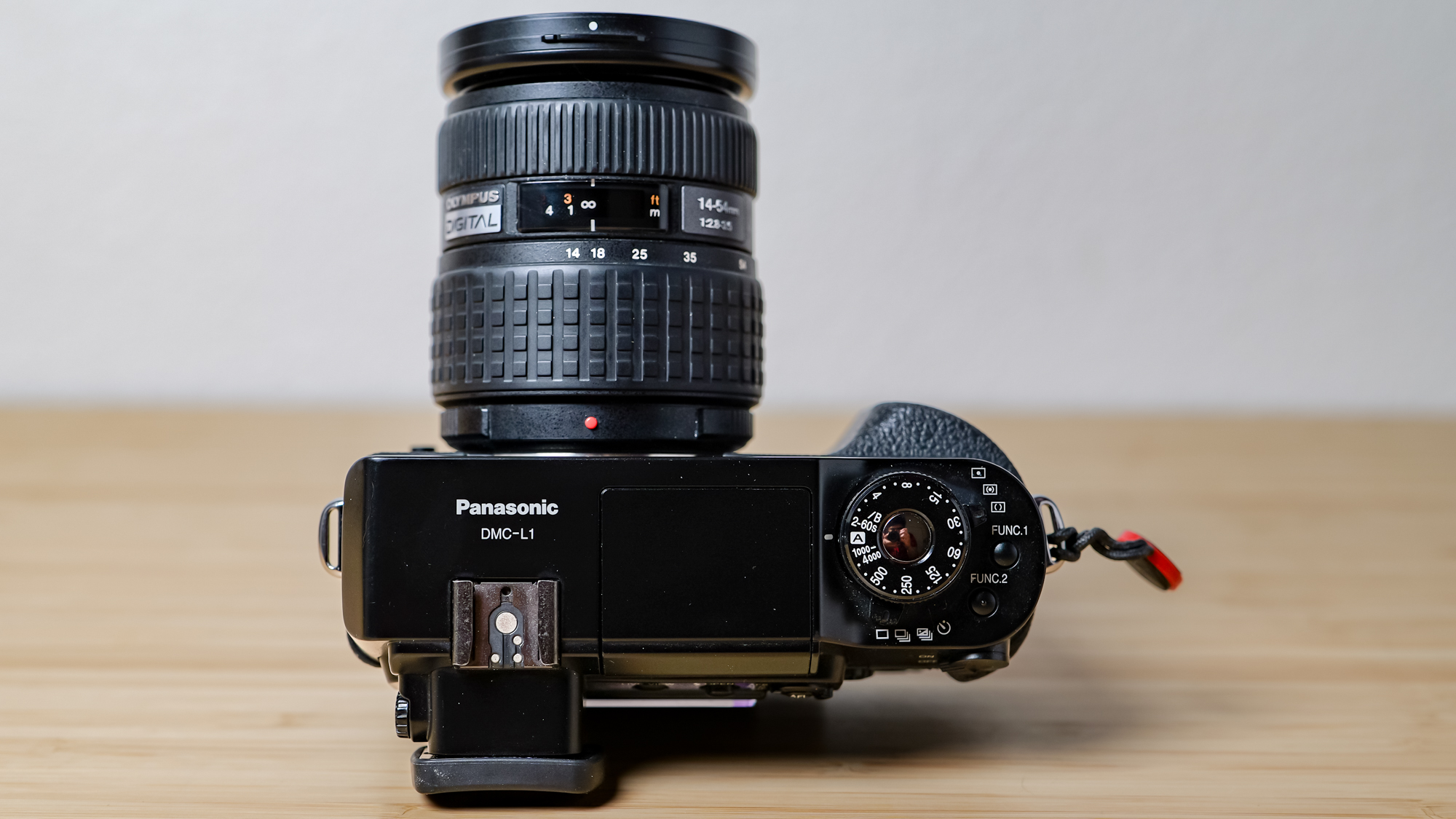 A photo of the Lumix L1 DSLR on a wooden surface