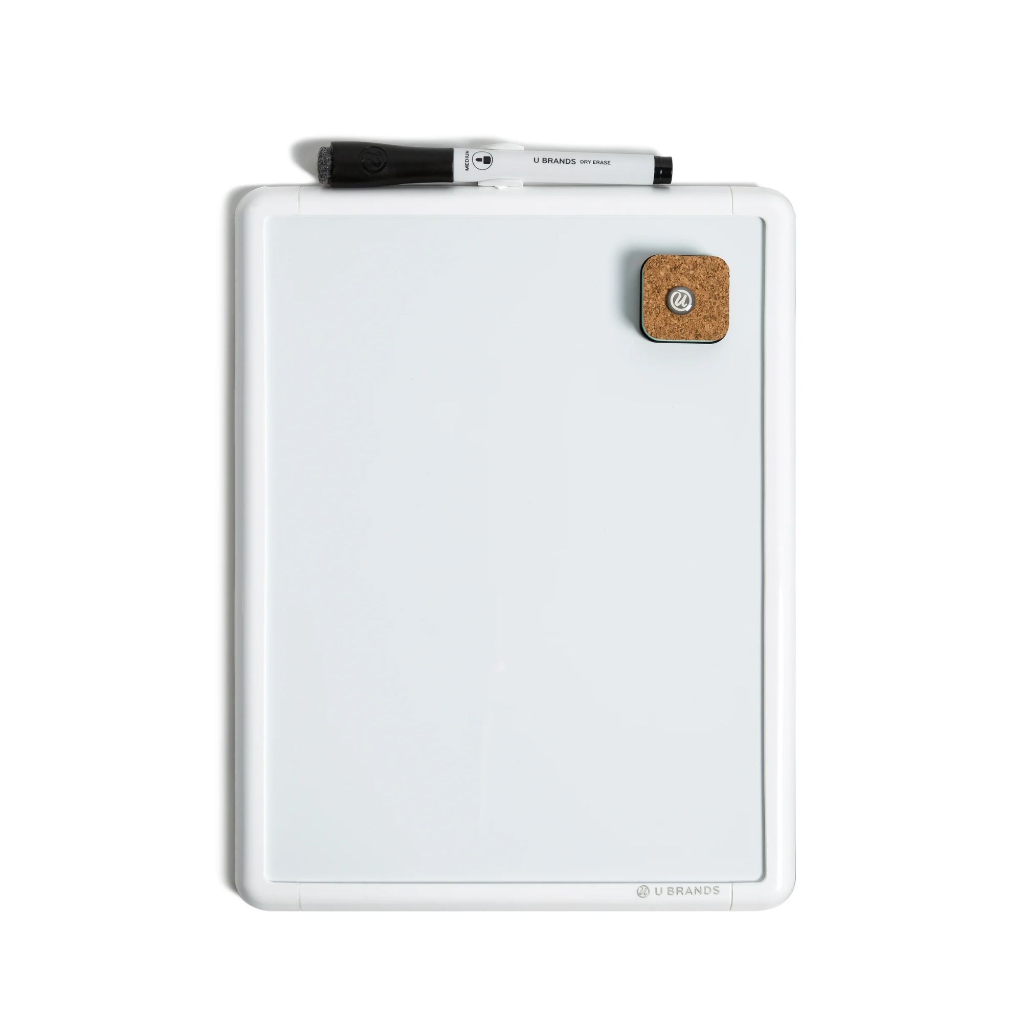 A white rectangular whiteboard with a black marker on top of it
