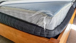 Mesh cloth enclosing the layers of the Emma Comfort Adapt mattress