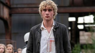 Joseph Zada looking serious in The Hunger Games: Sunrise on the Reaping