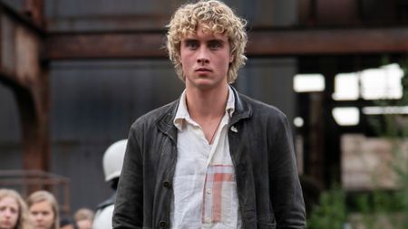 Joseph Zada looking serious in The Hunger Games: Sunrise on the Reaping