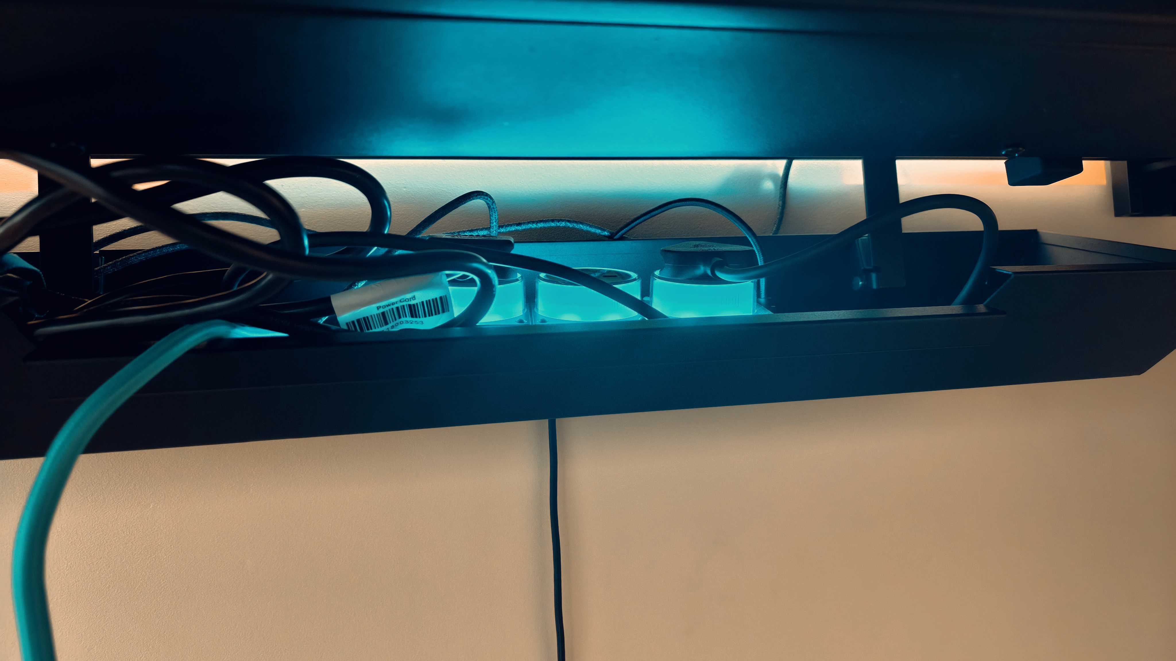 A black Secretlab Magnus Evo desk