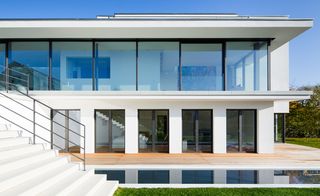 House exterior with white walls and swimming pool