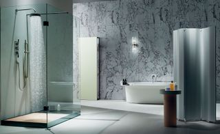 spacious bathrooms are kept minimal so the warm veins of the intricate marble can stand out.