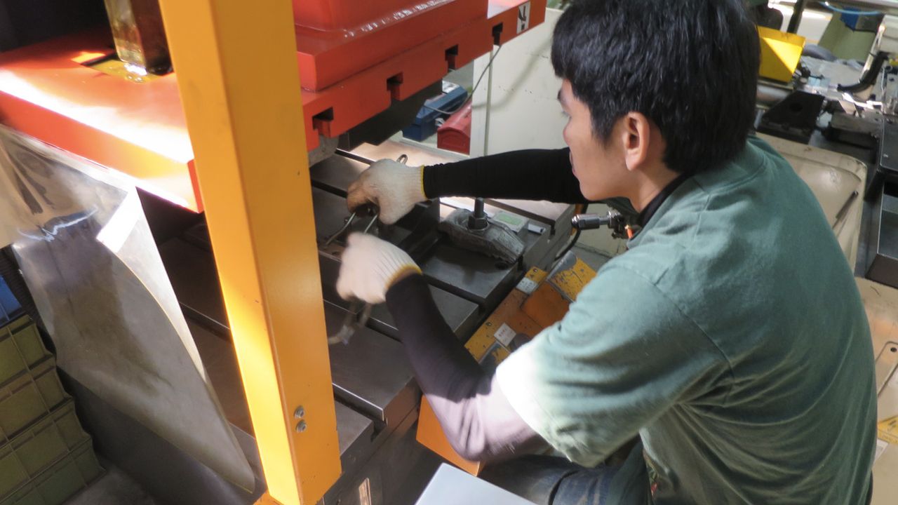 Each shaped rail is checked for alignment before continuing through assembly