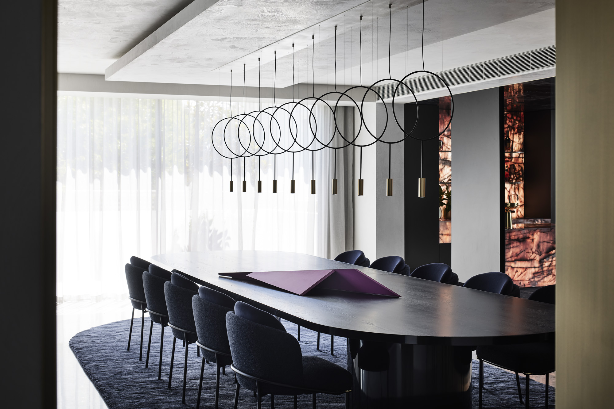 dinning space with light and art at Curatorial House in Melbourne