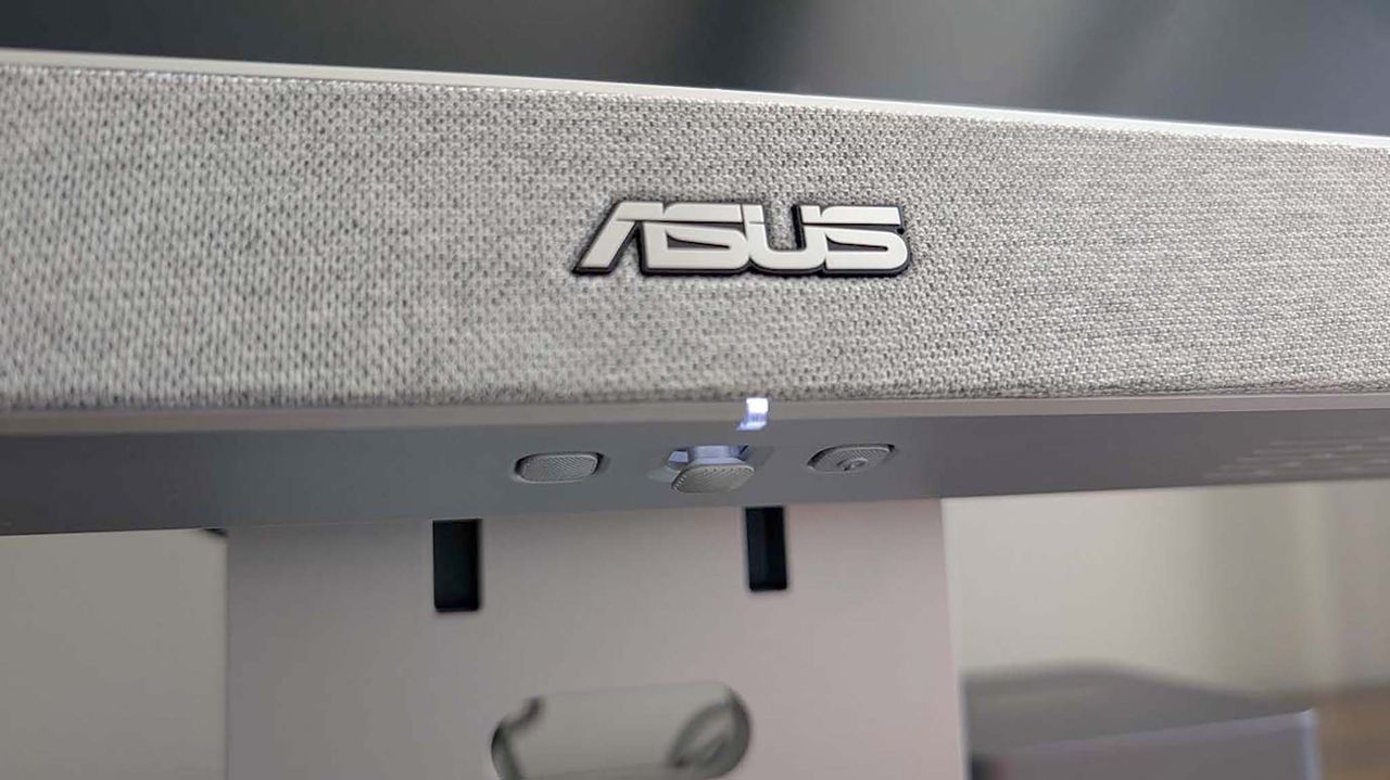 Closeup of the ASUS ZenScreen Smart TV MS27UC's OSD controls located under the monitor.