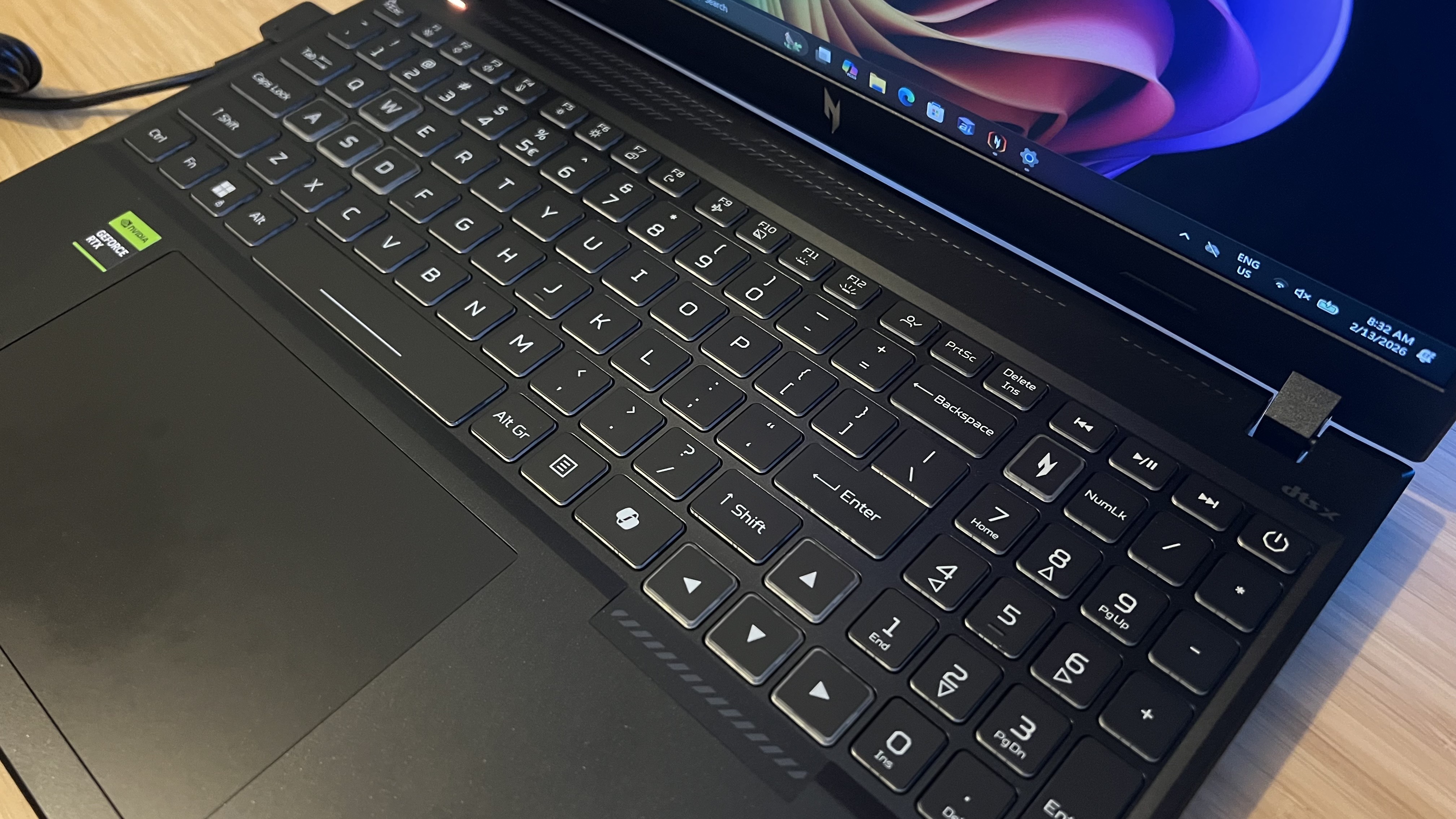 Top down view of keyboard and trackpad on Acer Nitro V 16 AI gaming laptop