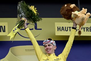 Team UAE Emirates Tadej Pogacar of Slovenia celebrates his overall leader yellow jersey on the podium at the end of the 18th stage of the 108th edition of the Tour de France cycling race 129 km between Pau and Luz Ardiden on July 15 2021 Photo by Philippe LOPEZ AFP Photo by PHILIPPE LOPEZAFP via Getty Images