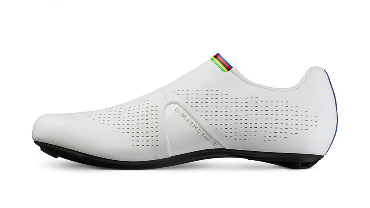 Rainbow accents feature on the tongue and heel of the shoe