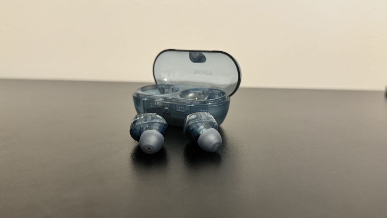 Sony WF-C710N earbuds in front of the charging case