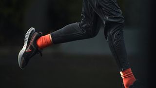 Legs of a runner wearing the Nike React Infinity Run 2