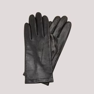 flat lay image of black leather gloves