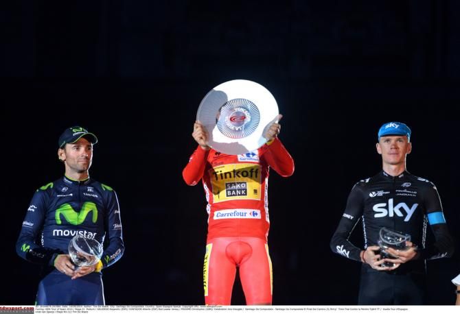 Alberto Contador (Tinkoff-Saxo) checks to see his name inscribed three times on the winners trophy