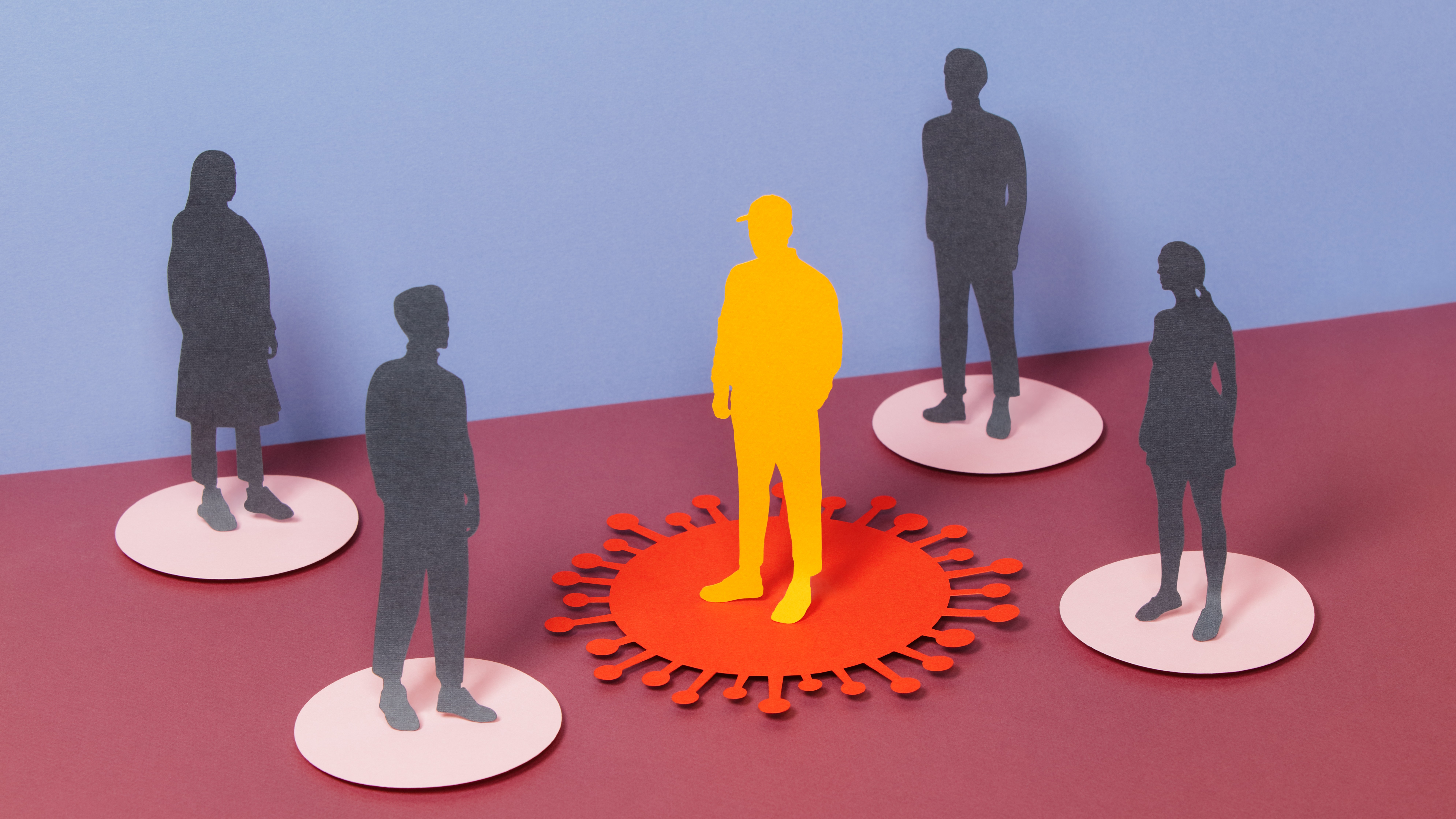 illustration depicting viral transmission. A yellow silhouette stands on a virus-shaped circle in the center; it is surrounded by the silhouettes of four other, uninfected people. 