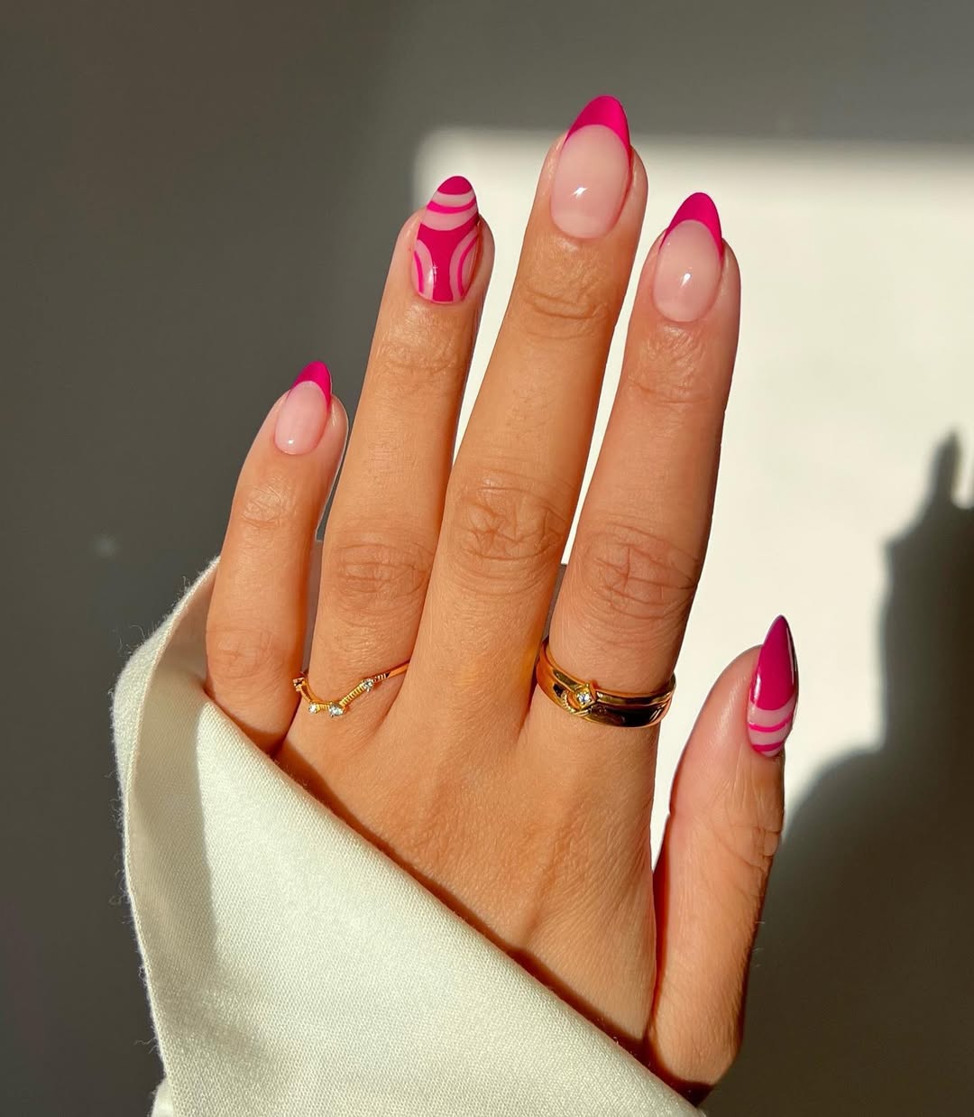 Abstract manicure with pink French tips by Iram Shelton