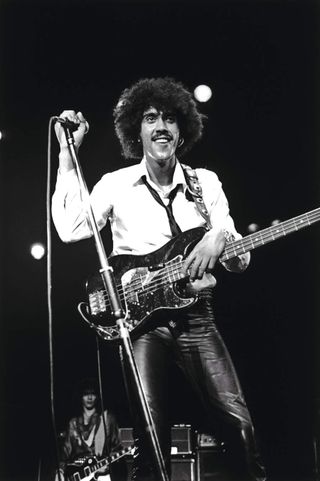 Phil Lynott onstage smiling