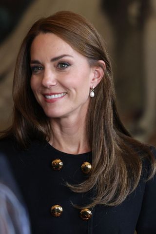 Kate Middleton headshot with a sleek side parted hairstyle