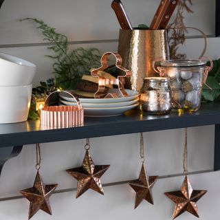 Blue kitchen shelf with copper cookie cutter