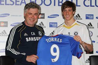 Manager Carlo Ancelotti (L) and Fernando Torres pose for the media at the Chelsea Press Conference on February 4, 2011 in Cobham, England.