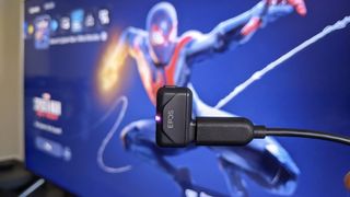 EPOS GTW 270 Hybrid Earbud USB-C dongle connected to a PS5